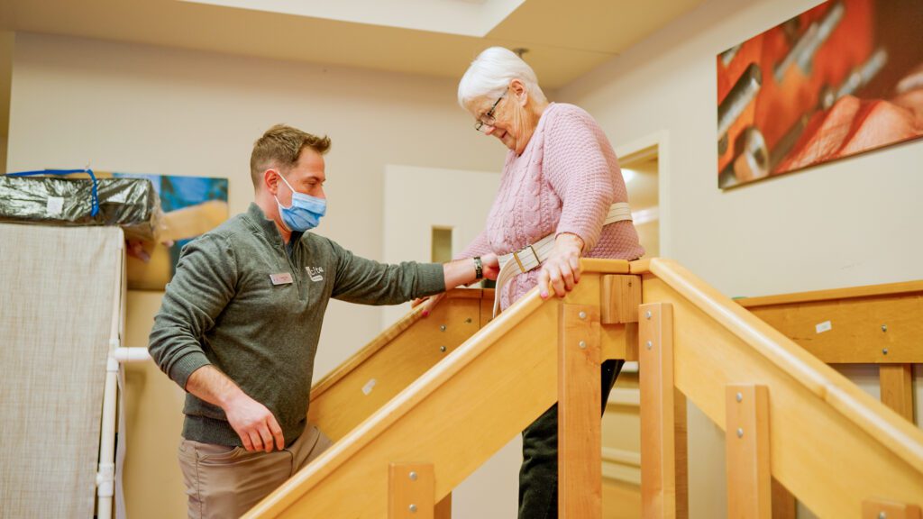 A woman uses therapy equipment for short term care